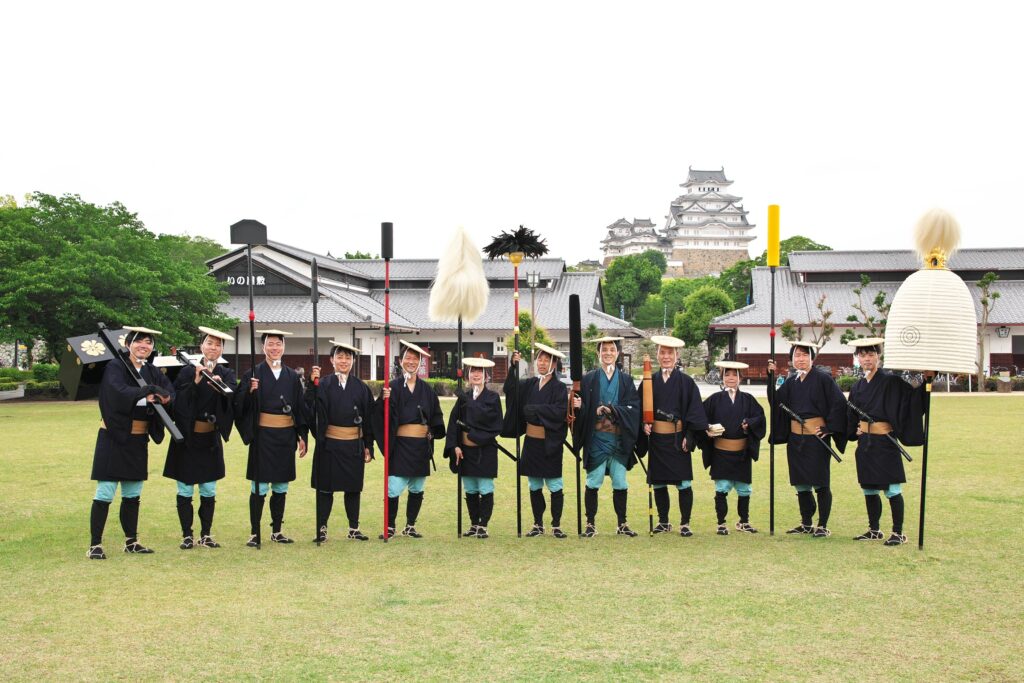 Step back in time at the Himeji Castle Festival! Our guide, Aki, joins the Daimyo Parade, a stunning reenactment of Edo-period samurai processions.